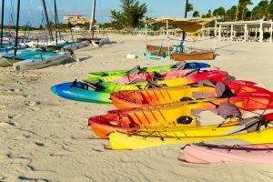 A rainbow of kayaks on the beach at Grace Bay in Turks and Caicos